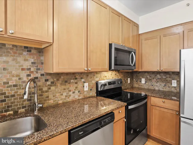a white refrigerator freezer sitting in a kitchen