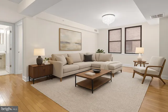 a living room with furniture and a window