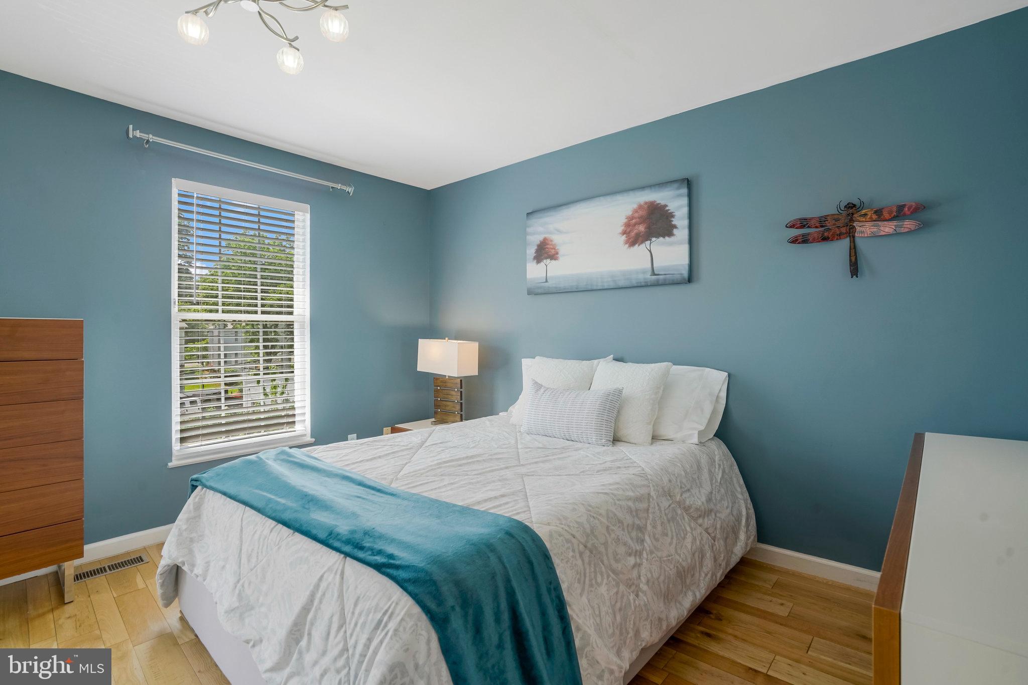 2181 Shirlington Road Arlington, VA 22206 - Photo 17 of 48 a bedroom with a large bed and a window