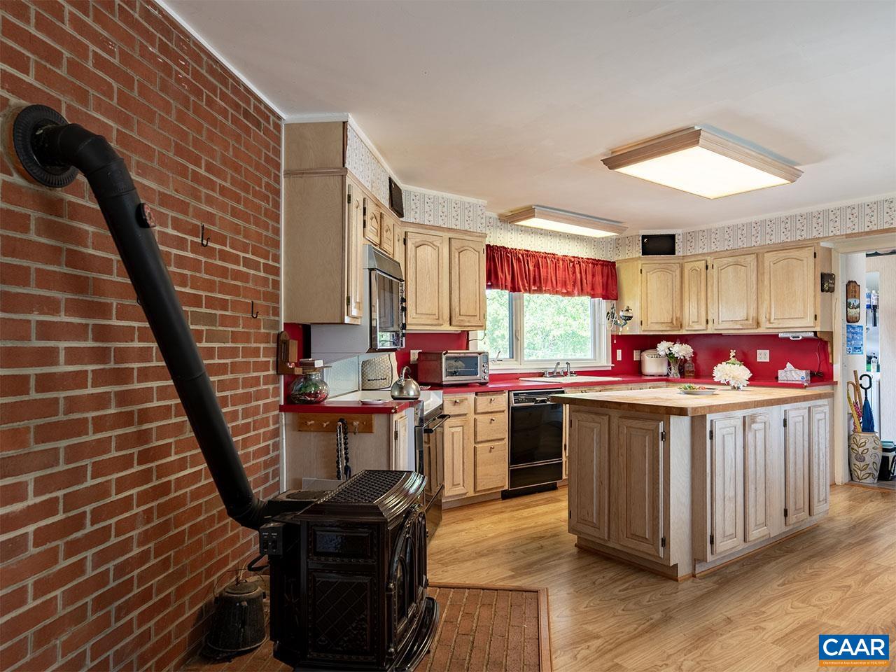 7230 Plank Road Afton, VA 22920 - Photo 14 of 37 a kitchen with lots of counter top space and wooden floor