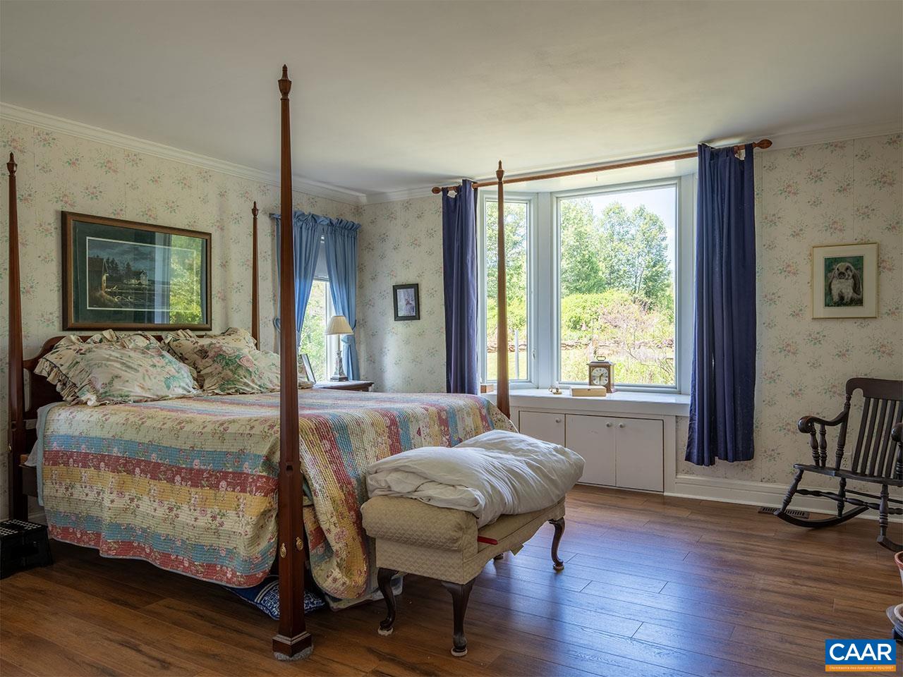 7230 Plank Road Afton, VA 22920 - Photo 16 of 37 a bedroom with a bed and a large window