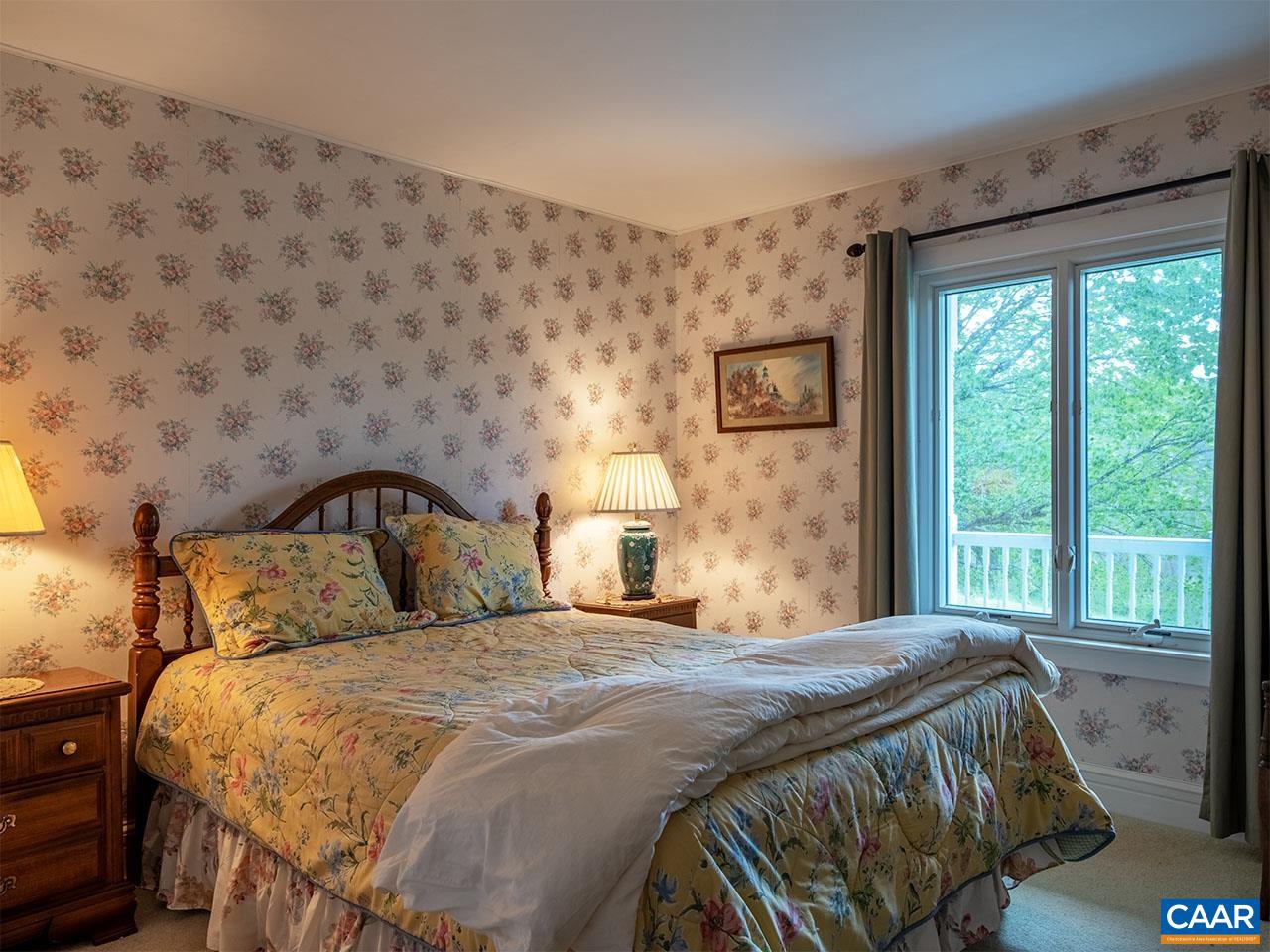 7230 Plank Road Afton, VA 22920 - Photo 20 of 37 a bedroom with a bed and a large window