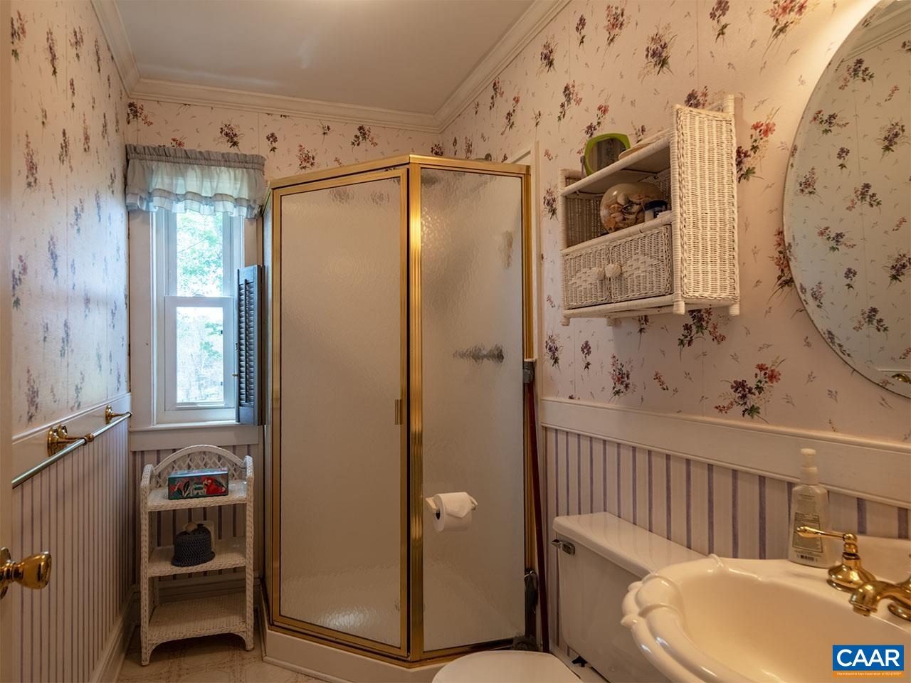 7230 Plank Road Afton, VA 22920 - Photo 21 of 37 a bathroom with a sink toilet and shower