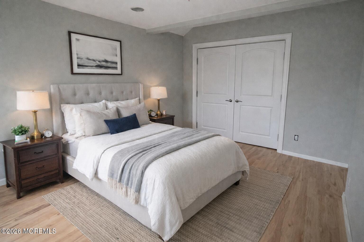 98 Raritan Avenue Keansburg, NJ 07734 - Photo 2 of 3 a bedroom with a bed and a night stand