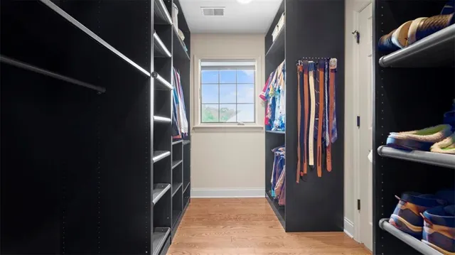 a view of hallway with stairs and furniture