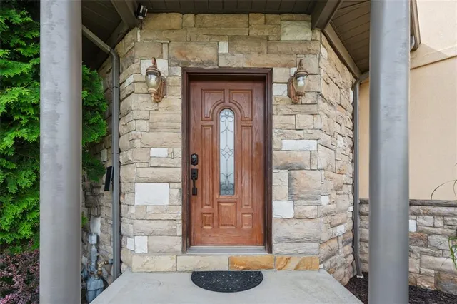 a front view of a house with a outdoor shower
