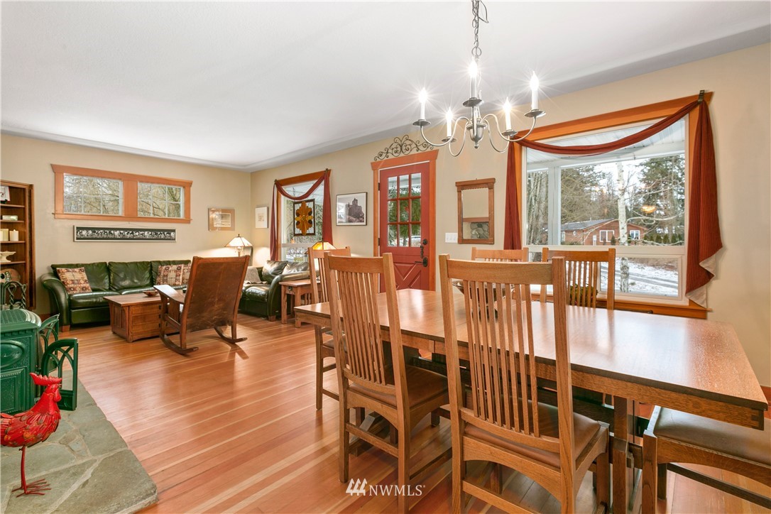 1000 Bellinger Road Bellingham, WA 98226 - Photo 13 of 40 a living room with furniture a chandelier and a dining table