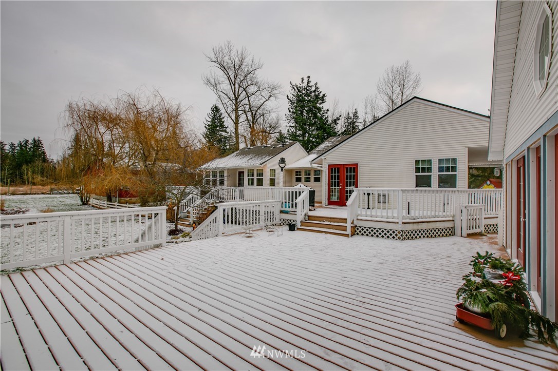 1000 Bellinger Road Bellingham, WA 98226 - Photo 22 of 40 a view of a house with wooden deck and furniture