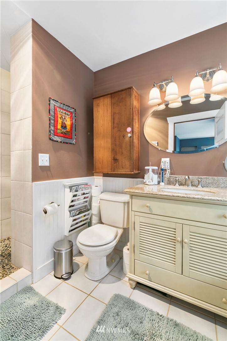 1000 Bellinger Road Bellingham, WA 98226 - Photo 32 of 40 a bathroom with a toilet a sink and mirror