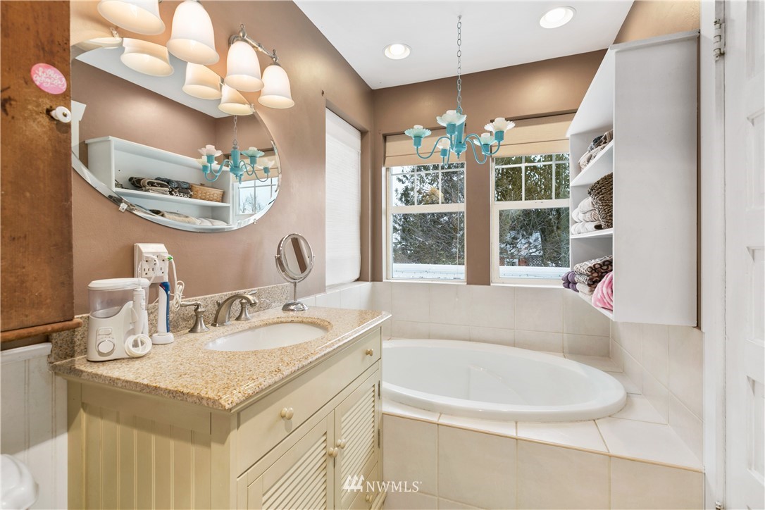 1000 Bellinger Road Bellingham, WA 98226 - Photo 33 of 40 a bathroom with a granite countertop sink and a mirror