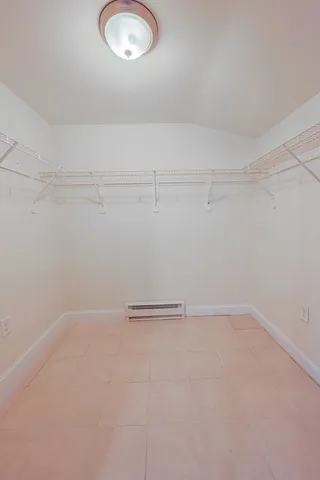 an empty room with wooden floor