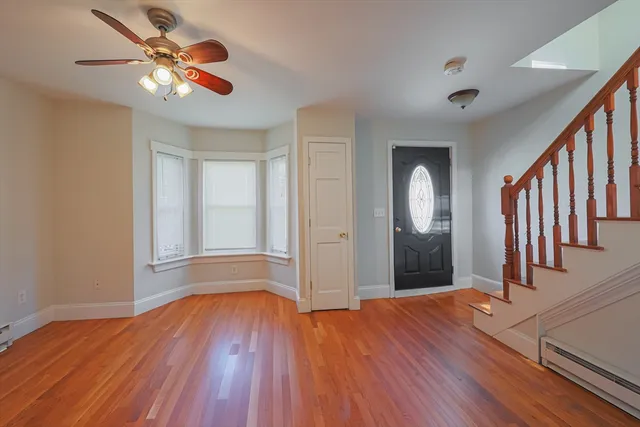 a view of a swimming pool with a yard and plants