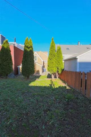 a view of a big yard with an house