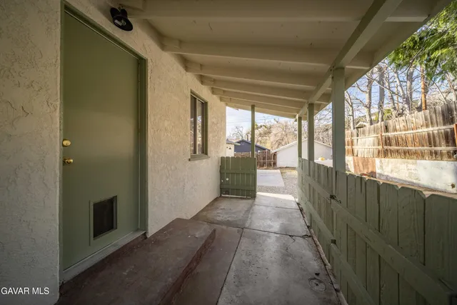 a couple of chairs in front of house