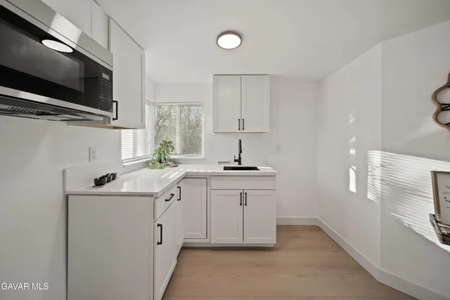 a living room with furniture and next to a window