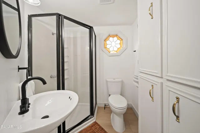 a aerial view of a house with a yard and garden