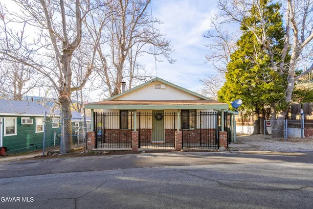 front view of a house with a garden