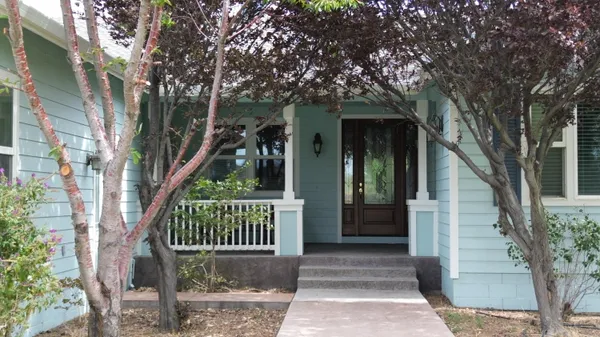 a kitchen with stainless steel appliances granite countertop a refrigerator and microwave