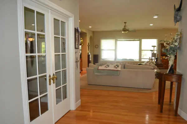 a view of a dining room with furniture kitchen and wooden floor