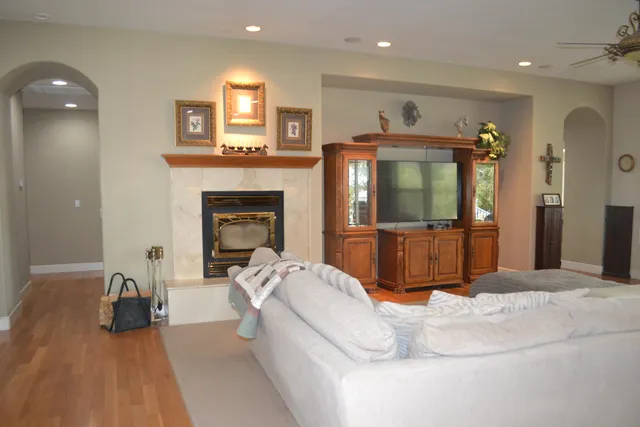 a living room with furniture and a fireplace
