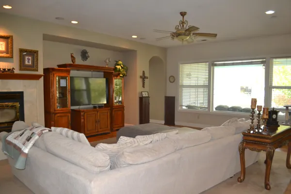 a bedroom with a bed and a flat tv screen