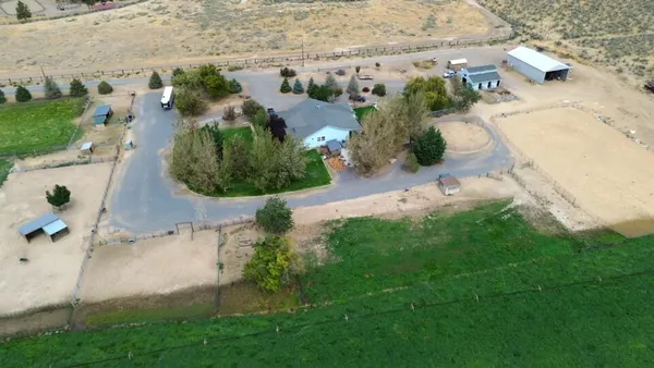 an aerial view of residential house with outdoor space