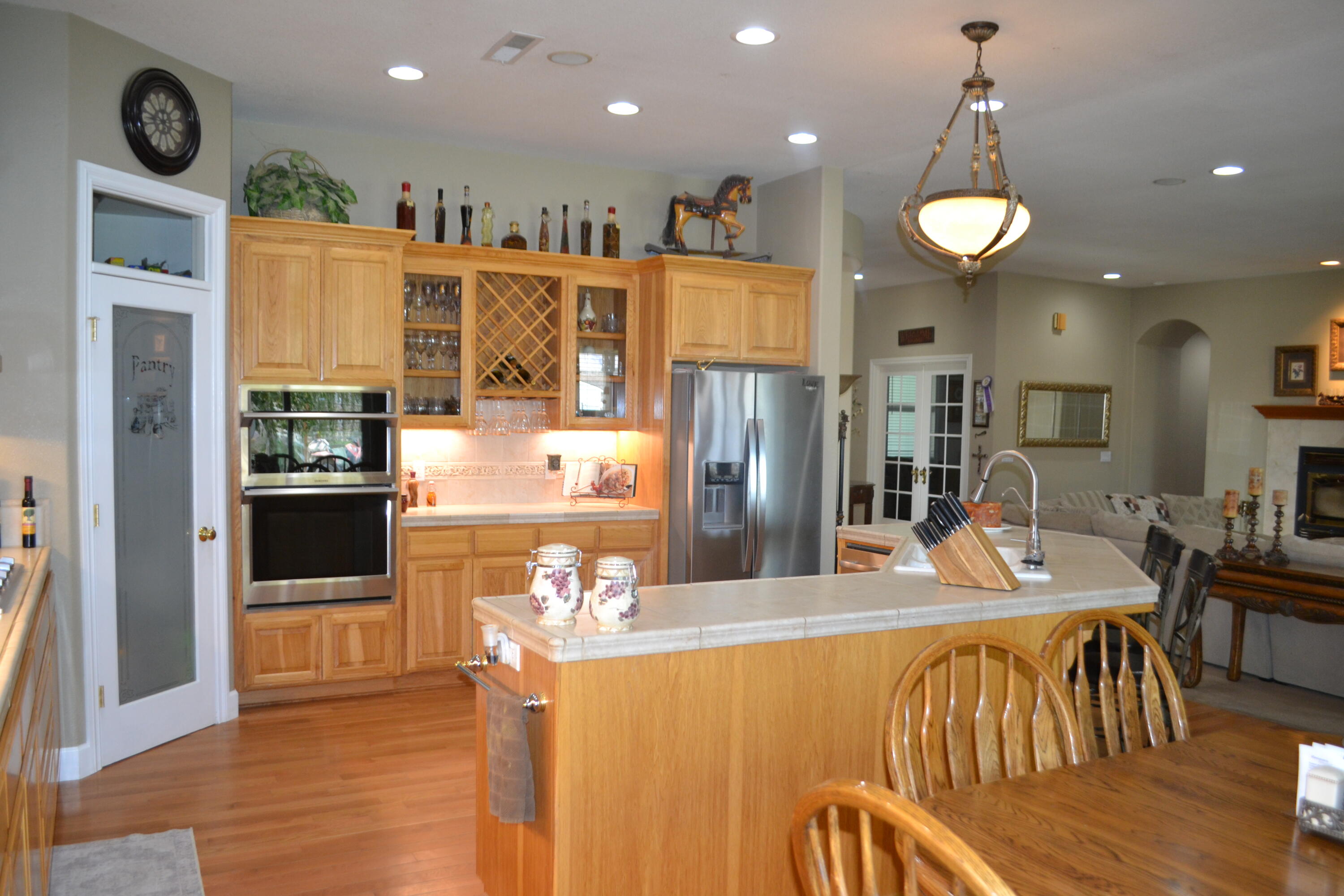 480-100 Belfast Road Litchfield, CA 96117 - Photo 25 of 100 a view of a dining room with furniture kitchen and wooden floor