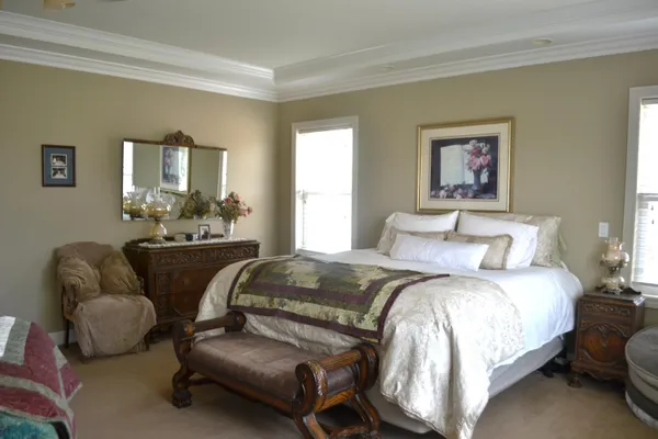 a view of a house with a yard and tree