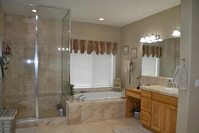 a view of a house with a yard and tree