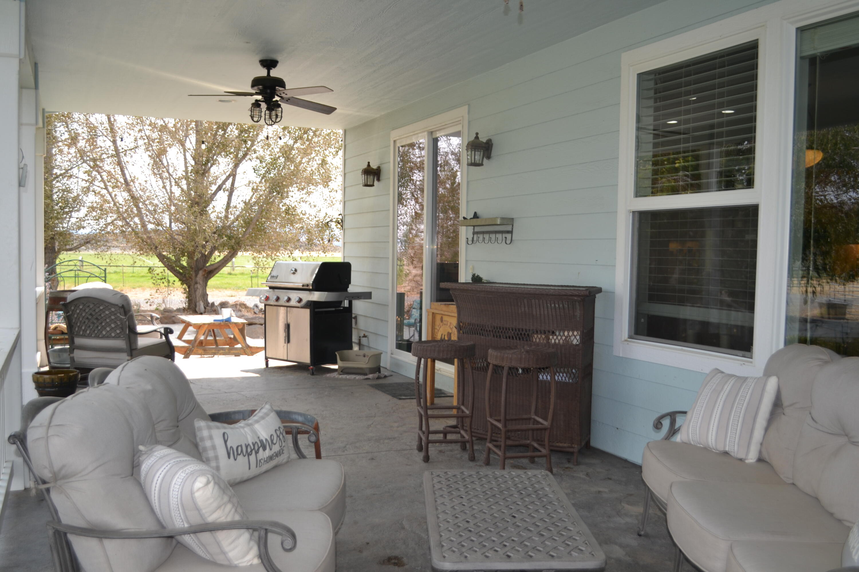 480-100 Belfast Road Litchfield, CA 96117 - Photo 52 of 100 a living room with furniture a fireplace and a floor to ceiling window