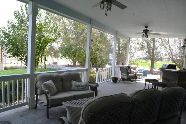 a living room with fireplace furniture and a wooden floor