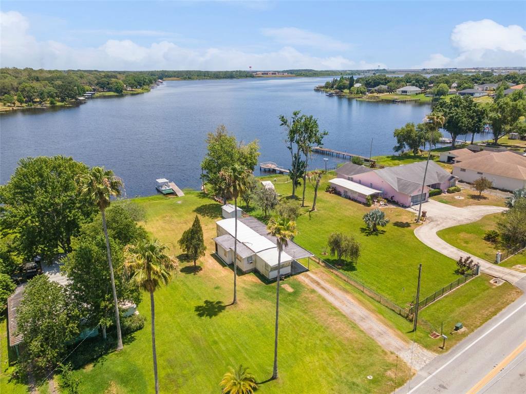 7558 Berkley Road Polk City, FL 33868 - Photo 13 of 16 an aerial view of a residential houses with outdoor space and lake view