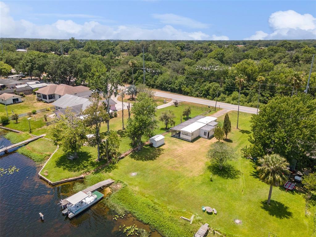 7558 Berkley Road Polk City, FL 33868 - Photo 14 of 16 an aerial view of residential houses with outdoor space