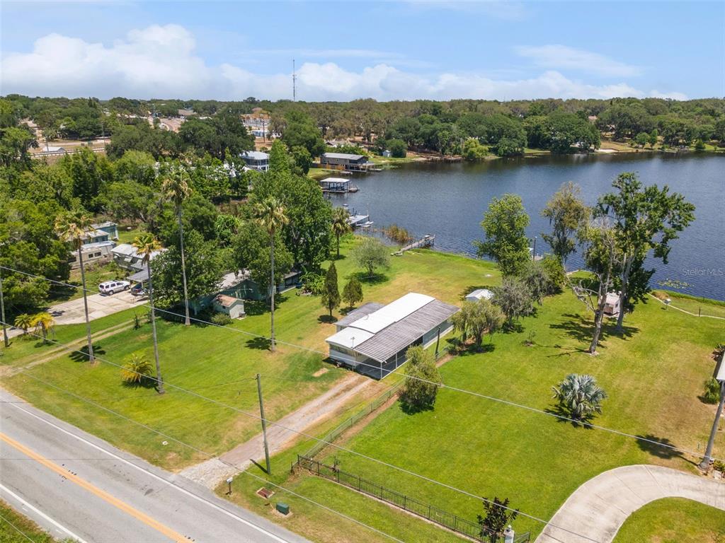 7558 Berkley Road Polk City, FL 33868 - Photo 15 of 16 an aerial view of a houses with a lake view