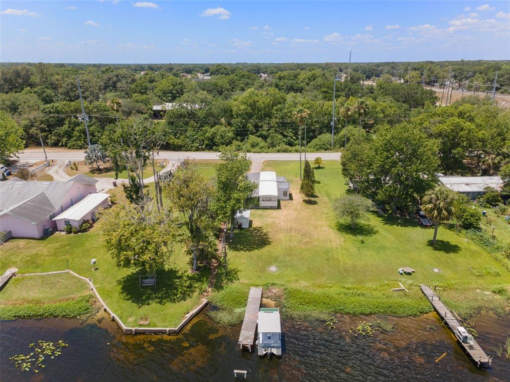 7558 Berkley Road Polk City, FL 33868 - Photo 16 of 16 an aerial view of residential houses with outdoor space