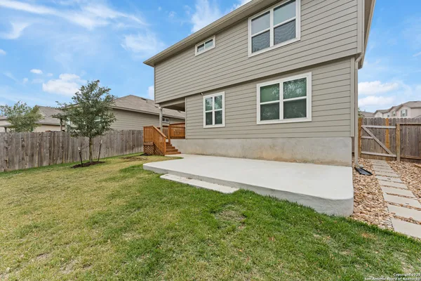 a house view with a backyard space