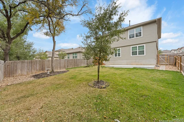 a backyard of a house with lots of green space