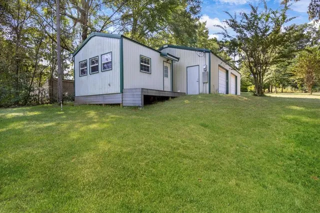 a view of a house with a back yard