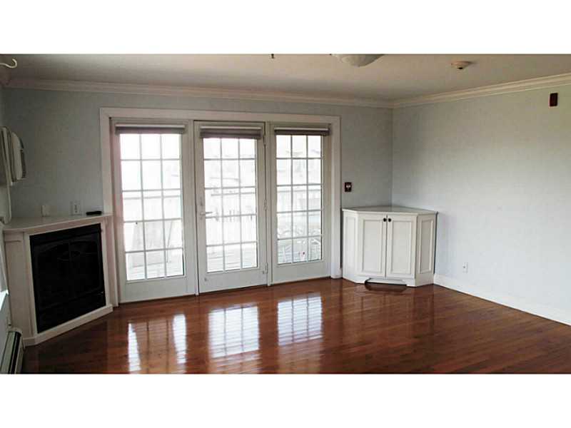 72 West Side Road, Unit 9 Block Island, RI 02807 - Photo 2 of 5 Den/Family/Great Room. Fireplace and custom wood features