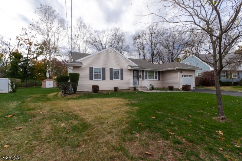 169 Valley View Road Hillside, NJ 07205 - Photo 2 of 32 a front view of a house with a garden