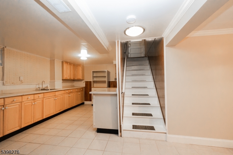 169 Valley View Road Hillside, NJ 07205 - Photo 25 of 32 a view of a kitchen with cabinets and entryway