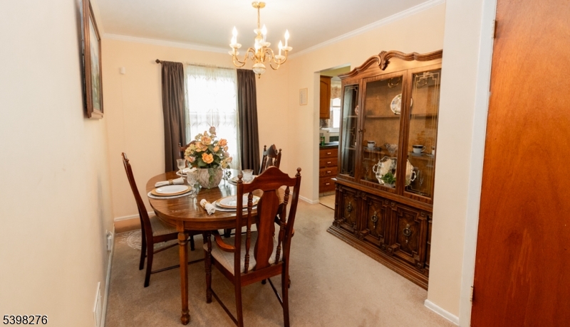 169 Valley View Road Hillside, NJ 07205 - Photo 5 of 32 a view of a dining room with furniture and chandelier
