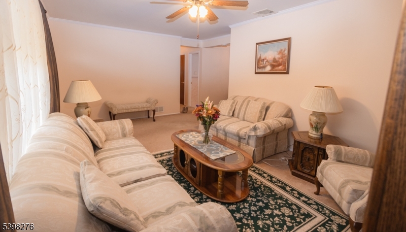 169 Valley View Road Hillside, NJ 07205 - Photo 7 of 32 a living room with furniture and a rug