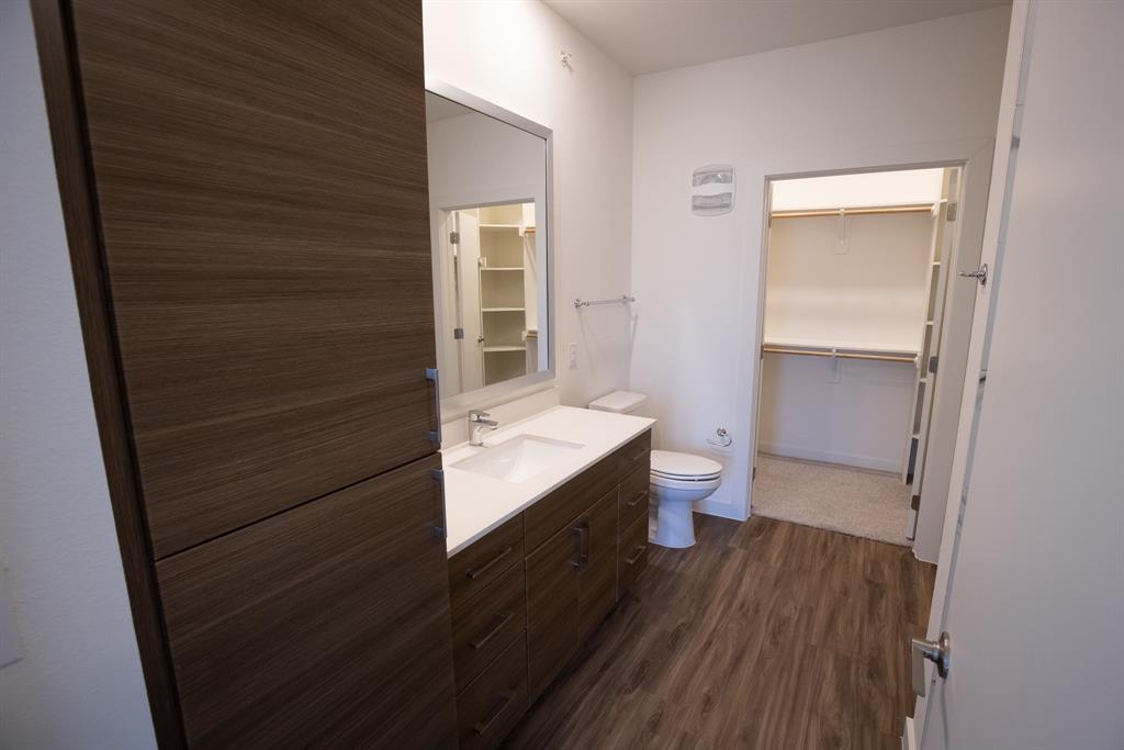 120 North Madison Avenue, Unit 1210 Dallas, TX 75208 - Photo 9 of 9 a bathroom with a sink and a toilet