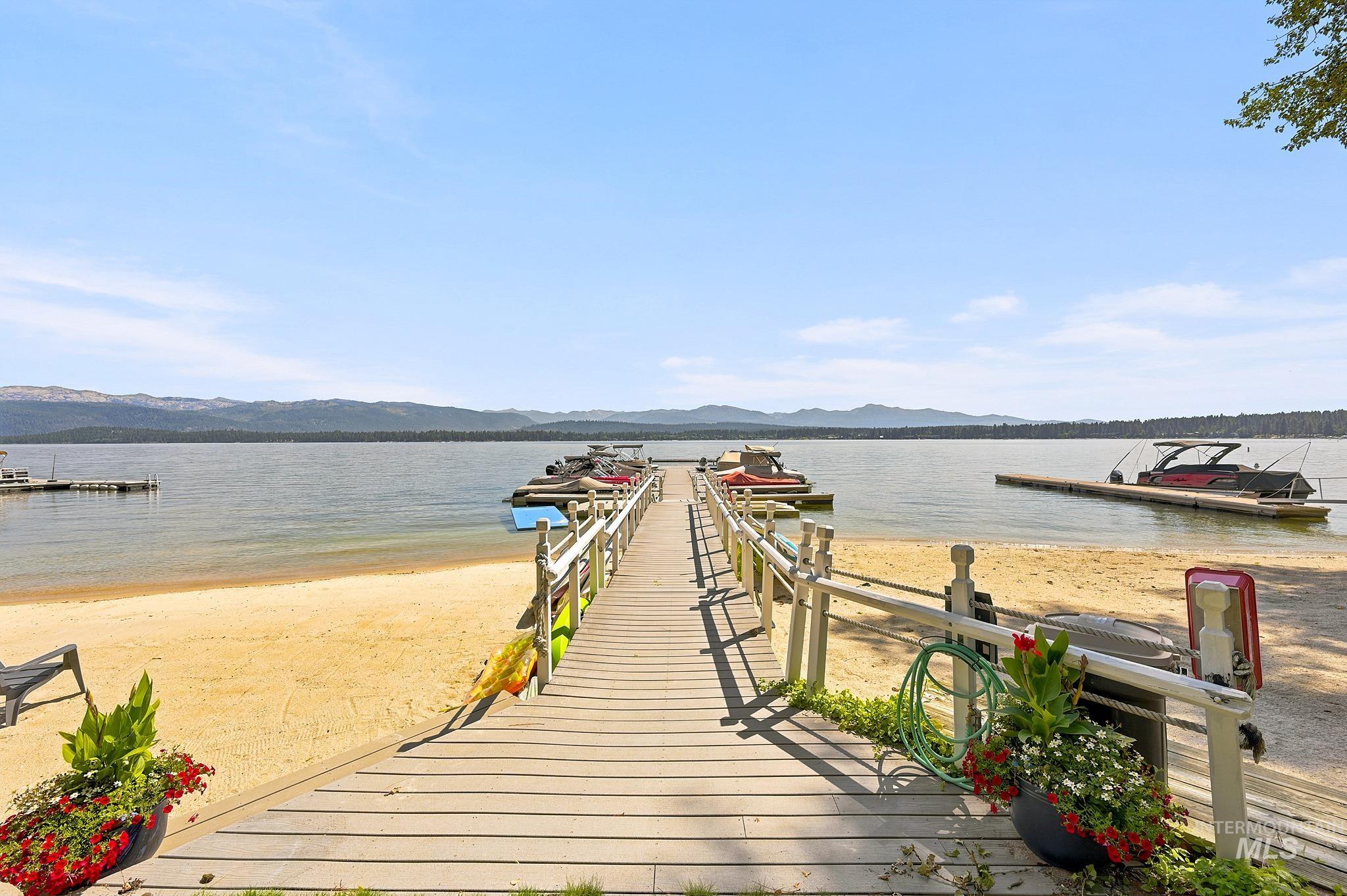 1552 Warren Wagon Road, Unit 3 McCall, ID 83638 - Photo 37 of 38 Waterfront property featuring multiple boat docks, sandy beach access, tennis courts, and an outdoor swimming pool