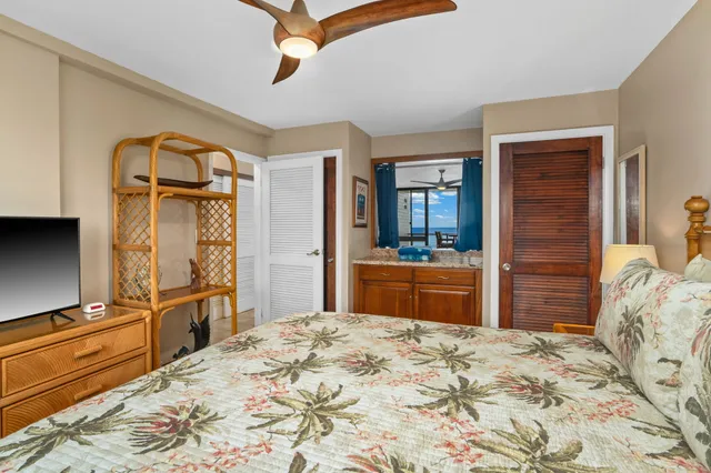 a bedroom with a bed and a dresser