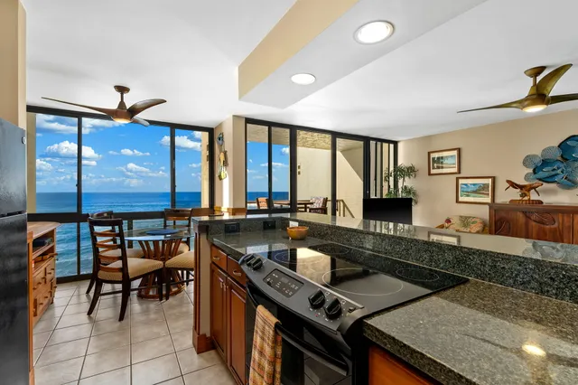 a kitchen with a stove a sink and a refrigerator