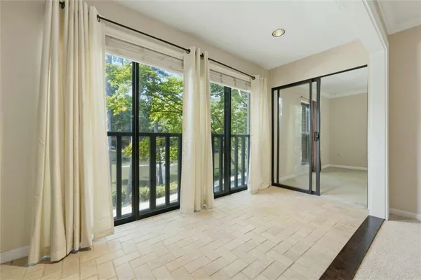 a view of a room with a large window