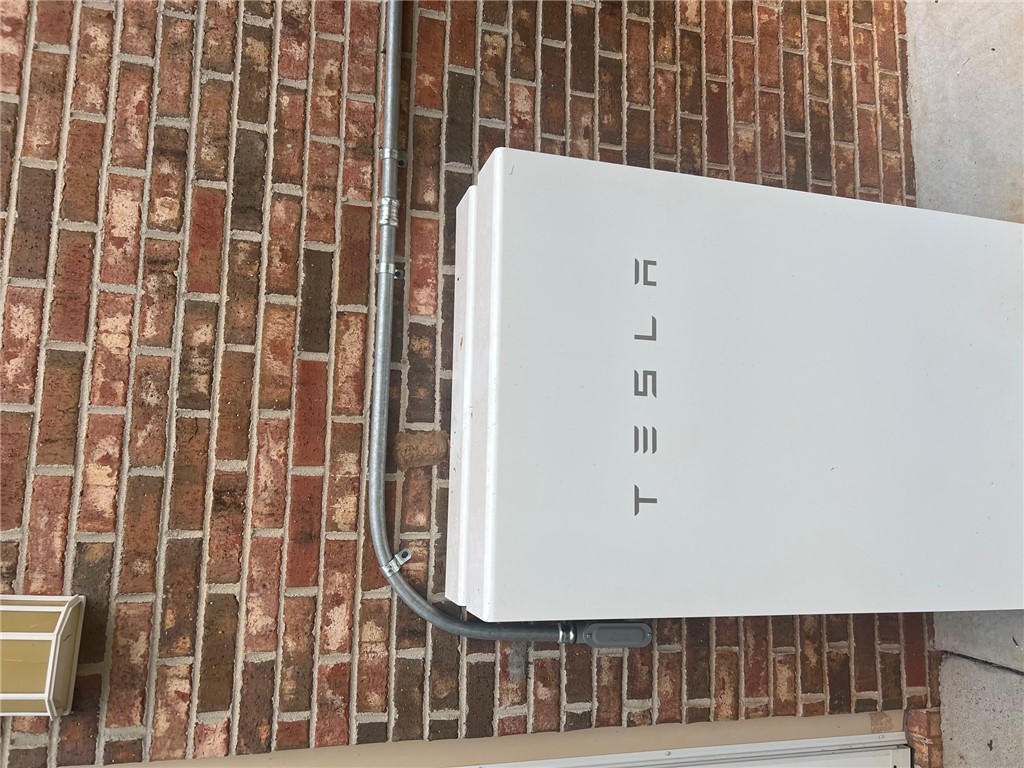 1002 Berkeley Drive Clemson, SC 29631 - Photo 25 of 25 An energy storage device mounts securely against a classic red brick exterior wall.