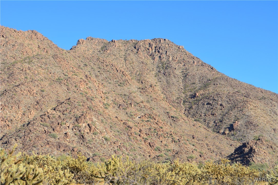 11626 Sherry Road Yucca, AZ 86438 - Photo 18 of 56 a view of a building with mountains in the background